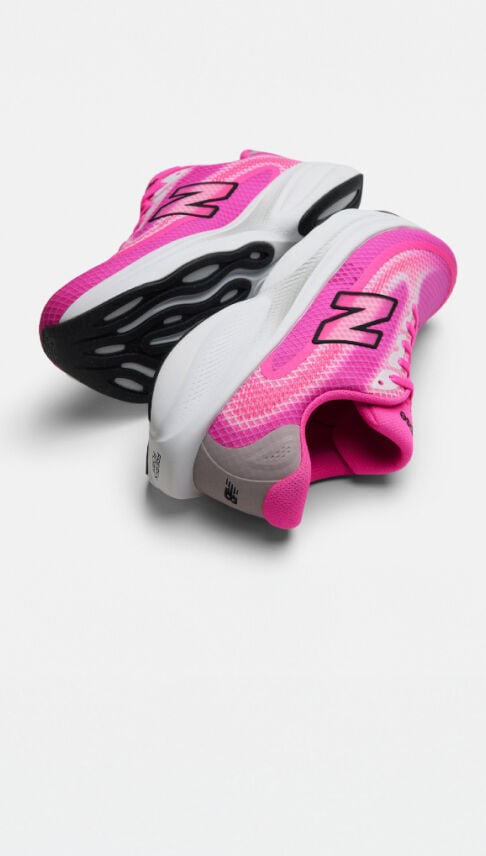 Single pink running shoe on a white background